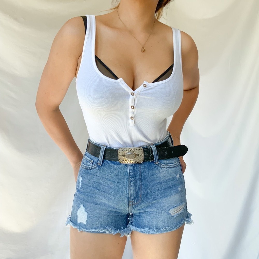 High waisted faded blue ripped denim jeans